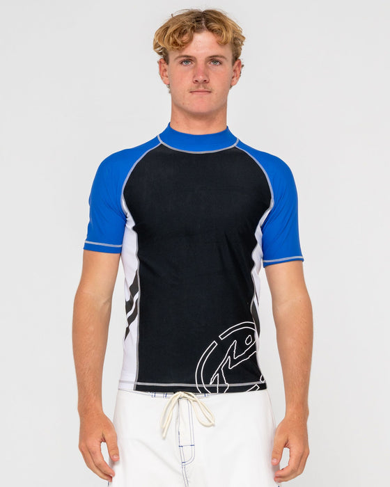 man-wearing-spitfire-short-sleeve-surf-top-in-black-1