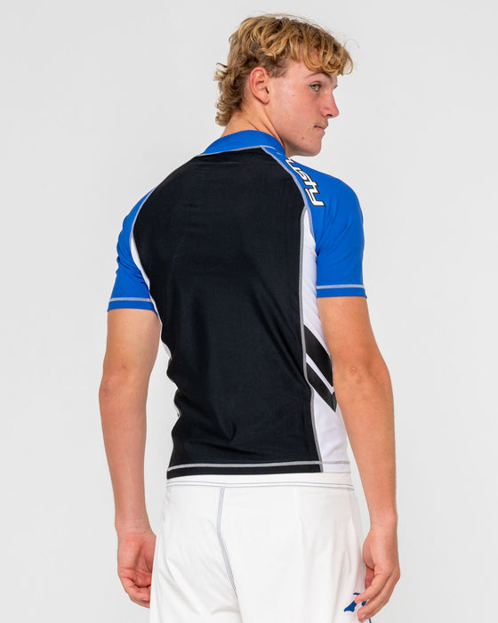 man-wearing-spitfire-short-sleeve-surf-top-in-black-1