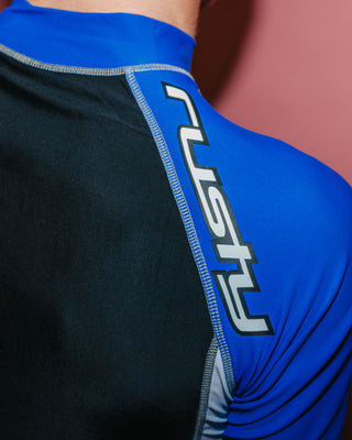 Man wearing Spitfire Short Sleeve Surf Top in Black 1