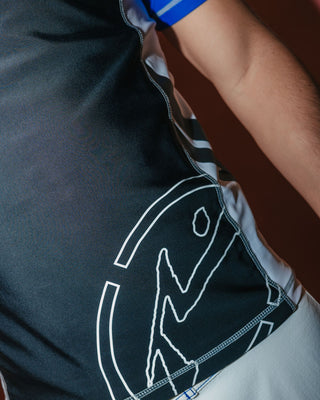 Man wearing Spitfire Short Sleeve Surf Top in Black 1