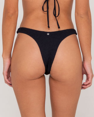 Woman wearing Sandalwood Brazilian Bikini Bottom in Black