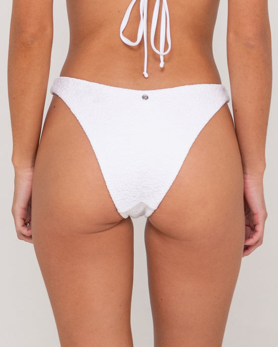 woman-wearing-sandalwood-brazilian-bikini-bottom-in-bright-white