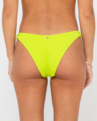Woman wearing Sandalwood Midi Bikini Bottom in Lime Punch