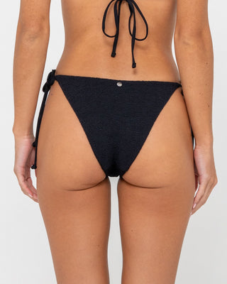 Woman wearing Sandalwood Midi Side Ties Bikini Bottom in Black