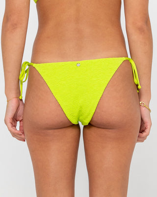 Woman wearing Sandalwood Midi Side Ties Bikini Bottom in Lime Punch