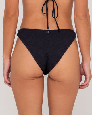 Woman wearing Sandalwood Classic Bikini Bottom in Black