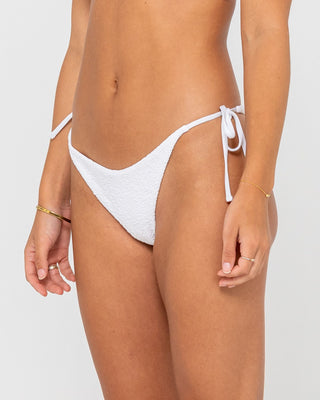 Woman wearing Sandalwood Brazilian Ties Bikini Bottom in Bright White