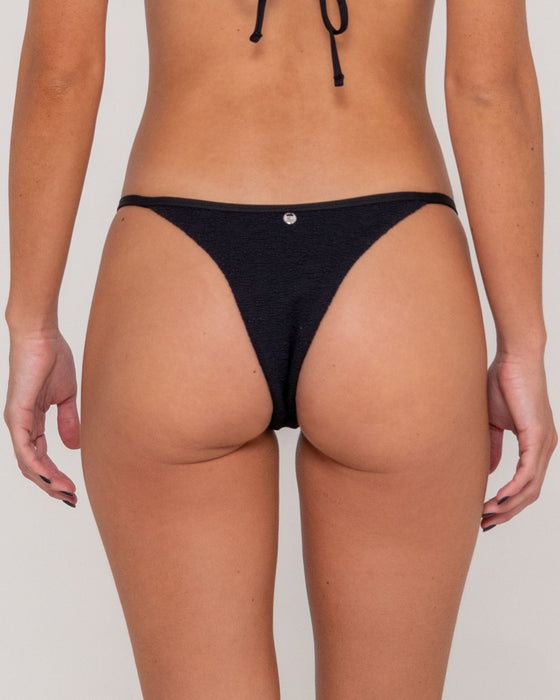 woman-wearing-sandalwood-ring-cheeky-bikini-bottom-in-black