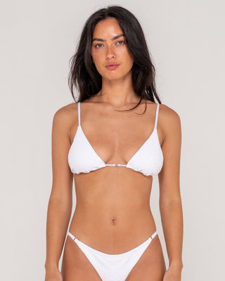 Woman wearing Sandalwood Ring Bikini Top in Bright White