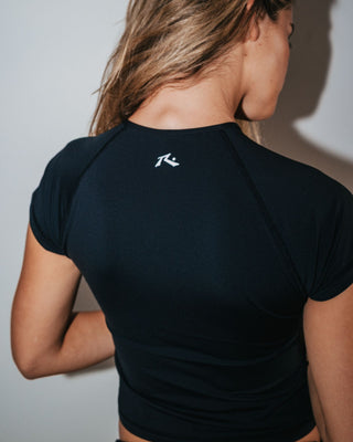 Woman wearing Essentials S/S Zip Through Rash Vest in Black