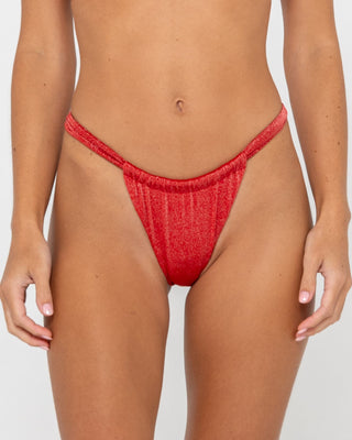 Woman wearing Shimmy String Bikini Bottom in Red