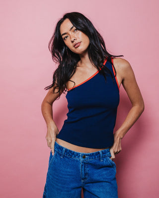 Woman wearing Zoe One Shoulder Tank in Navy