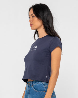 Woman wearing Rusty Essentials Relaxed Mini Tee in Navy Blue