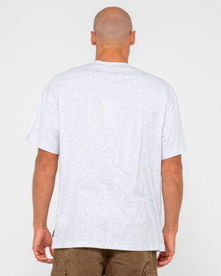 Man wearing Vital Rusty Short Sleeve Tee in Ecru Marle