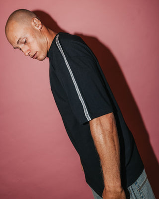 Man wearing Gaffa Taped Short Sleeve Tee in Black