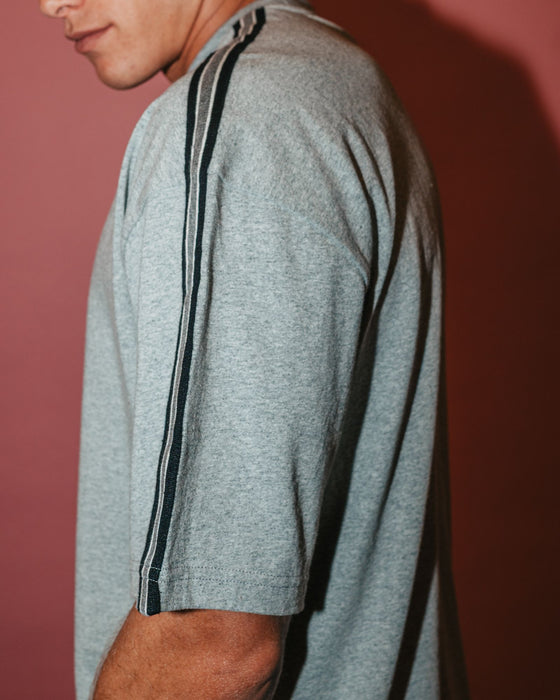 man-wearing-gaffa-taped-short-sleeve-tee-in-grey-marle