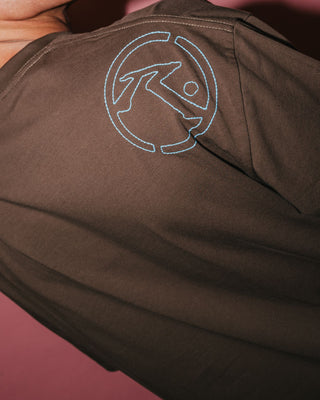 Man wearing Hoodus Short Sleeve Tee in Pinecone