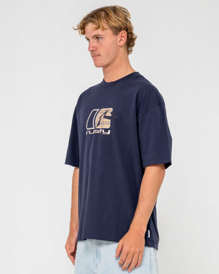 Man wearing Checkout Short Sleeve Tee in Navy Blue