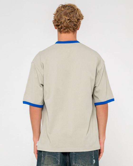 man-wearing-hyper-ringer-short-sleeve-tee-in-abbey-stone