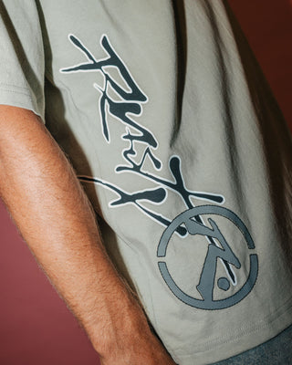 Man wearing Spraya Short Sleeve Tee in Abbey Stone