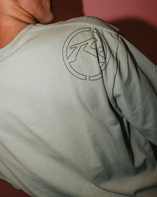 Man wearing Spraya Short Sleeve Tee in Abbey Stone