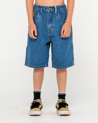 Boy wearing Flip Daddy Low Ballin Jort Boys in Middy Blue 1