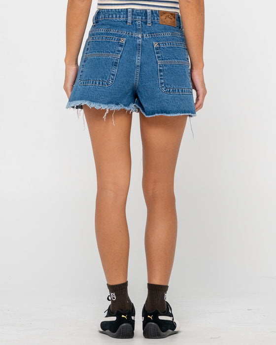 woman-wearing-penny-kick-flare-denim-short-in-middy-blue