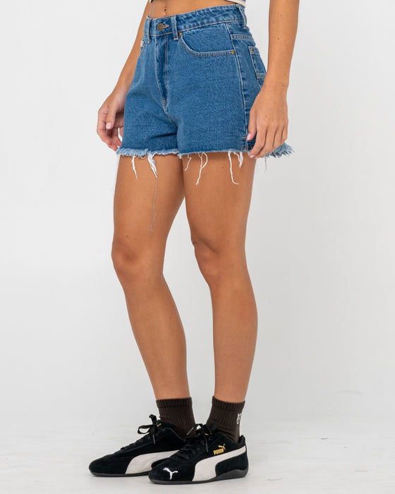 woman-wearing-penny-kick-flare-denim-short-in-middy-blue