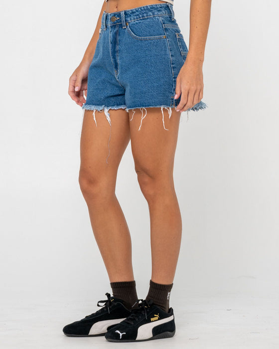 woman-wearing-penny-kick-flare-denim-short-in-middy-blue