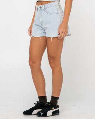 Woman wearing Penny Kick Flare Denim Short in Sky Blue Heather