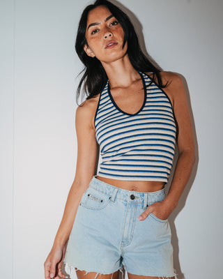Woman wearing Penny Kick Flare Denim Short in Sky Blue Heather