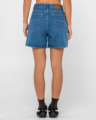 Woman wearing Cyprus High Denim Short in Middy Blue