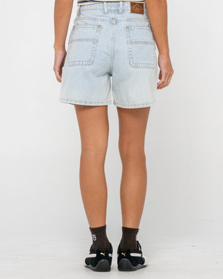 Woman wearing Cyprus High Denim Short in Sky Heather Blue