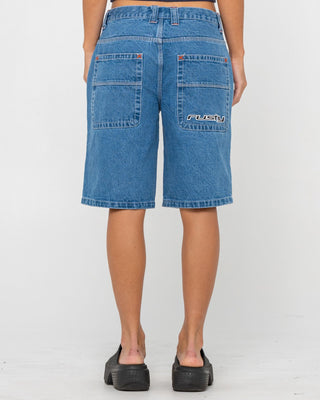 Woman wearing Flip Mommy Low Rise Wide Leg Denim Jort in Middy Blue / Orange