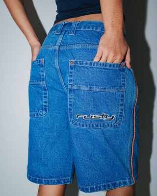 Woman wearing Flip Mommy Low Rise Wide Leg Denim Jort in Middy Blue / Orange