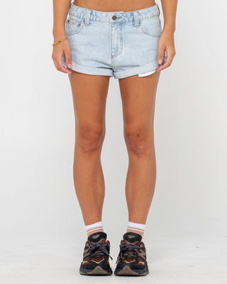 Woman wearing Pheonix Low Rise Denim Mini Short in Sky Blue Heather