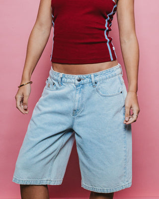 Woman wearing Bethany Baggy Low Rise Denim Jort in Sky Blue Heather