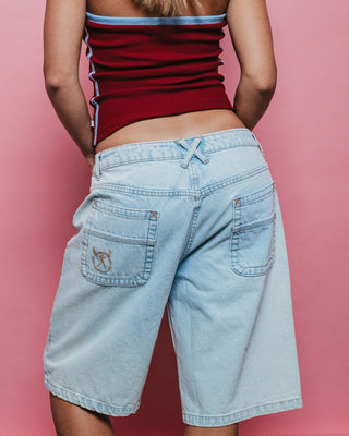 Woman wearing Bethany Baggy Low Rise Denim Jort in Sky Blue Heather