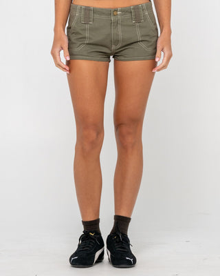 Woman wearing Dirtbag Cargo Low Rise Mini Short in Light Khaki