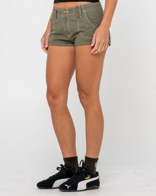 Woman wearing Dirtbag Cargo Low Rise Mini Short in Light Khaki