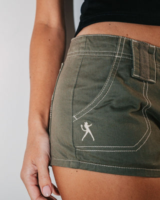 Woman wearing Dirtbag Cargo Low Rise Mini Short in Light Khaki