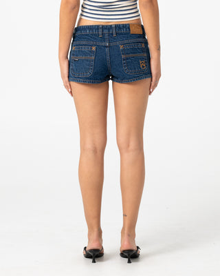 Woman wearing Lemmy Low Rise Micro Mini Short in Deep Sea Blue