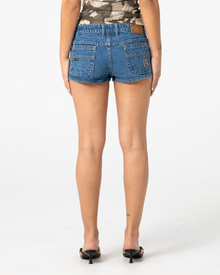 Woman wearing Lemmy Low Rise Micro Mini Short in Middy Blue