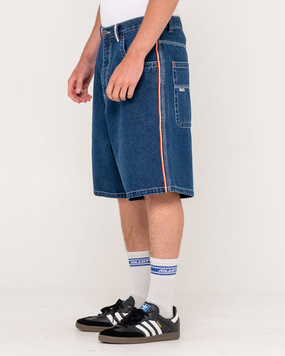 man-wearing-flip-daddy-2-0-jort-deep-sea-blue-in-deep-sea-blue-orange