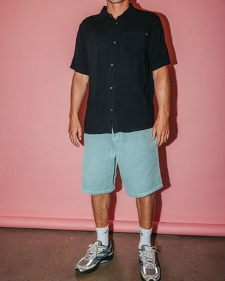 Man wearing Flip Daddy Tapeless Cord Short in Smoke Blue