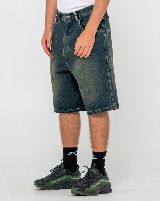 man-wearing-stone-cold-baggy-jort-in-dark-n-dirty