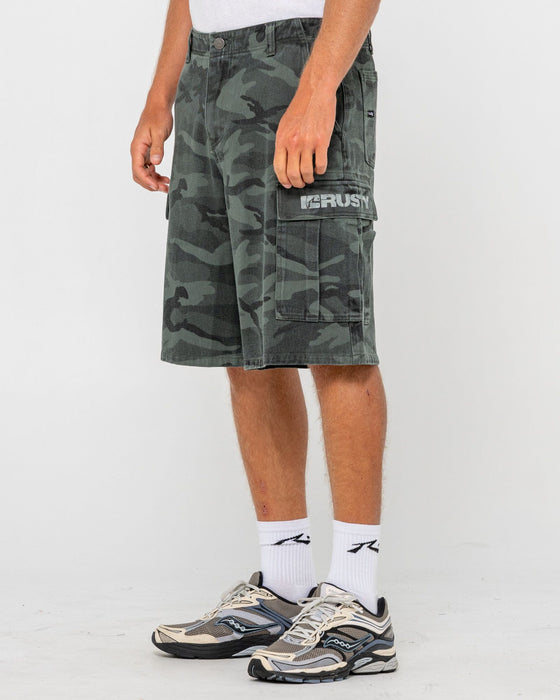 man-wearing-commando-camo-cargo-short-in-overdyed-camo