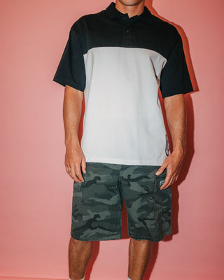 Man wearing Commando Camo Cargo Short in Overdyed Camo
