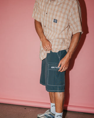 Man wearing Commando Rippa Cargo Short in Dark Sapphire