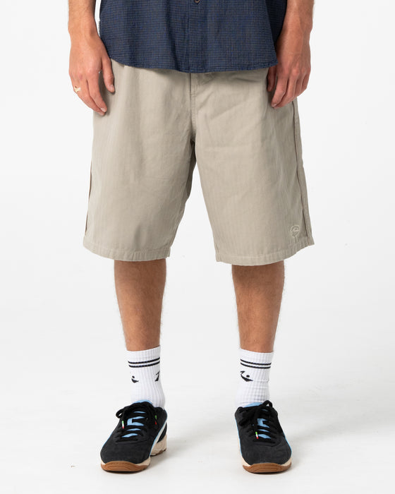 man-wearing-request-line-herringbone-short-in-abbey-stone
